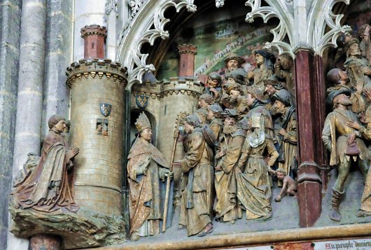 Vie de saint Firmin : le donateur agenouillé (Adrien de Hénencourt) et l'entrée de saint Firmin à Amiens